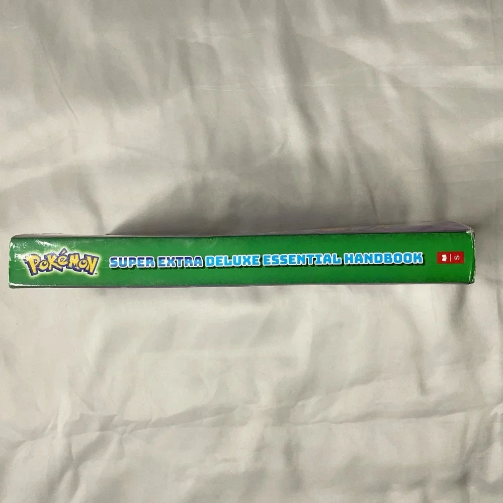 Pokémon Super Deluxe Essential Handbook Updated Pokédex Guide Book Scholastic